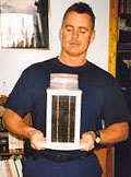 Senior Chief Dennis Dever holding Model 702