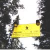 Hanging sign for drivers to prepare to stop with two flashing lights on it.