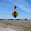 Solar-powered intersection ahead warning sign flashing beacon