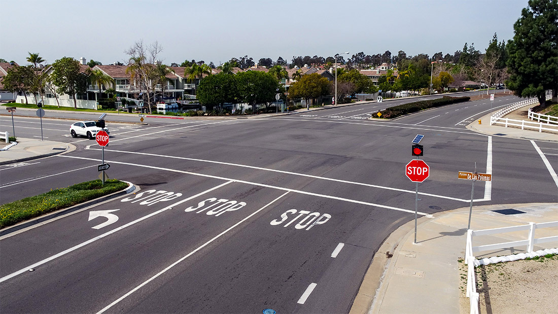 Four-way stop intersection in Yorba Linda, California, controlled by solar-powered stop sign flashing beacons