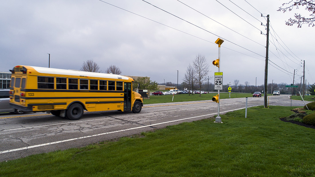 Solar-powered flashing school zone speed sign beacon in Indianapolis, Indiana