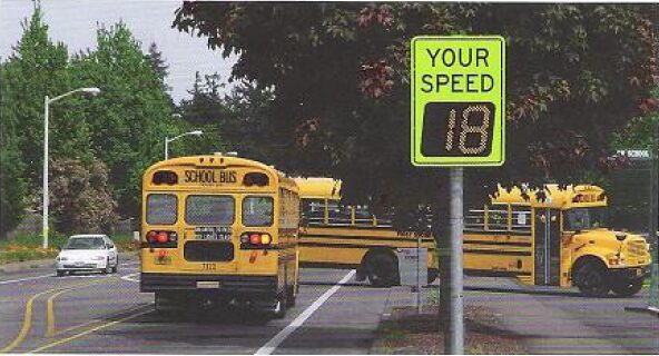 School buses and Your Speed digital sign. Image from the Public Risk Magazine