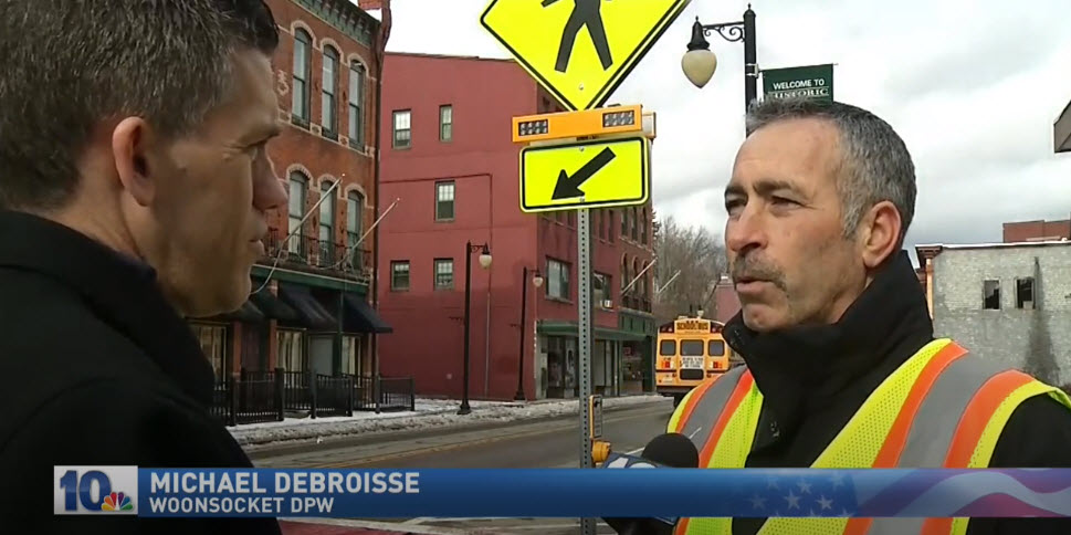 NBC 10 screengrab showing Carmanah RRFB at crosswalk in Woonsocket, Rhode Island, while Mike Debroisse speaks about it