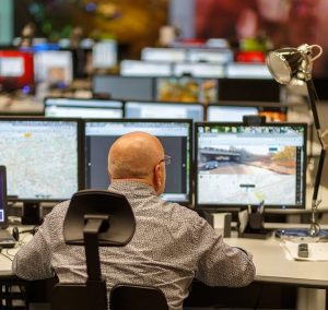 person monitoring traffic at a traffic management operations center