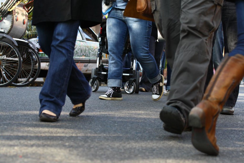 image of pedestrian's feet on a busy sidewalk